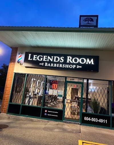 The Legends Room Barbershop shopfront on Fraser Highway after dark